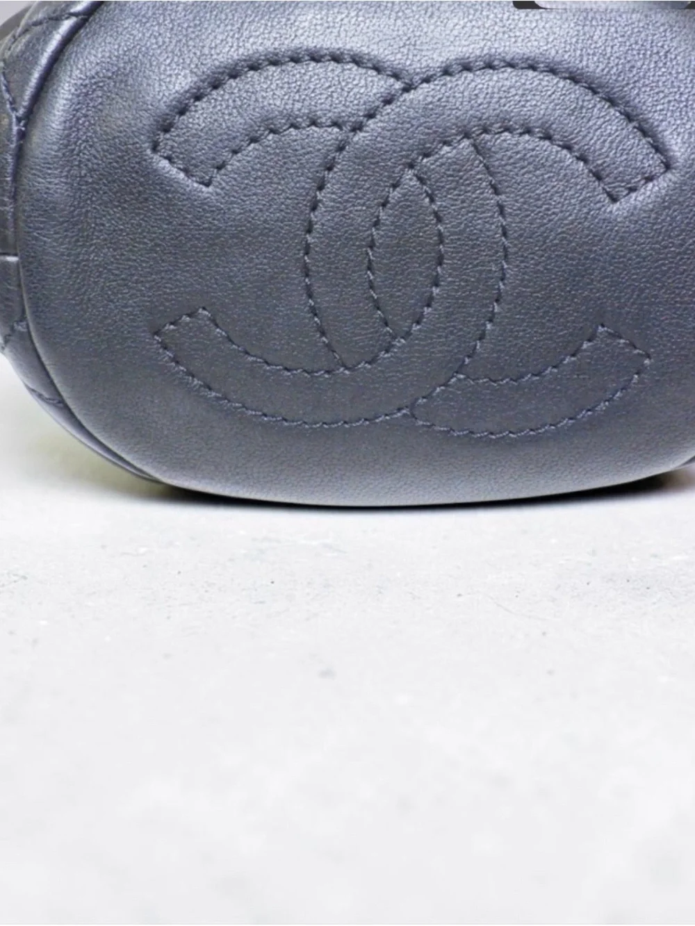CHANEL Pearl Drawstring Bucket Bag in Black Quilted Lambskin with Pearl Strap